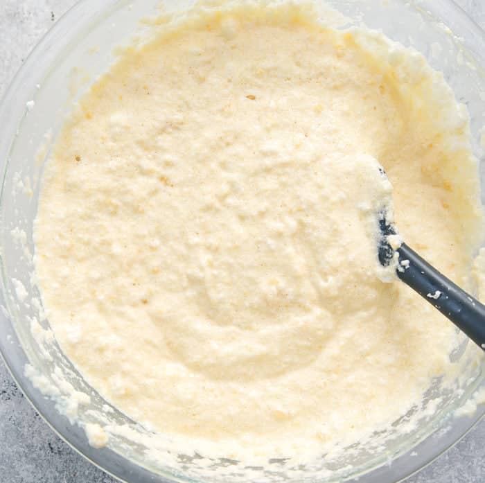 Prep photo showing whipped egg whites folded into cauliflower bread batter